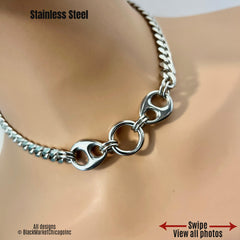 Shiny discreet bdsm sub day collar; 8mm silver stainless steel curb chain; it’s 24/7 wear, 18mm thick center o-ring affixed by sturdy jump rings, adorned with smooth, oval chunky side stabilizing ornaments, and a permanent locking clasp option.