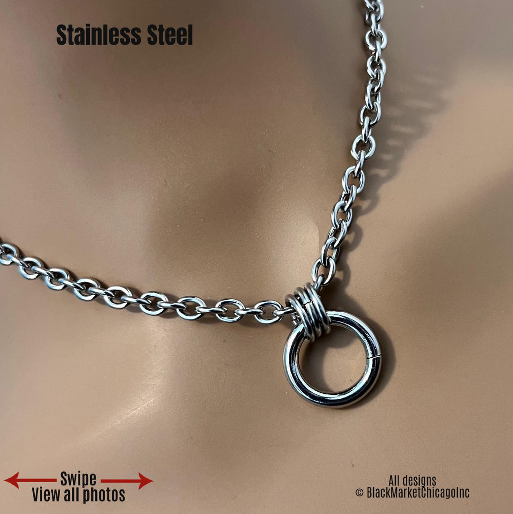 Submissive bdsm day collar; minimalist discreet; all stainless steel; small oval cable chain; thick, shiny 18mm  center ring affixed by 3 thick large jump rings, making it a hang-free pendant necklace; optional permanent locking ring closure.