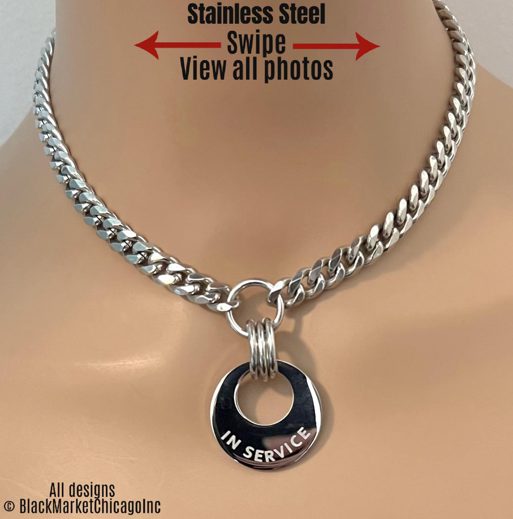 Submissive day collar; silver stainless steel curb chain necklace with a 1" center round cut-out pendant engraved with 'IN SERVICE' or any brief 12-character word or phrase of choice; sturdy, waterproof, lockable option.