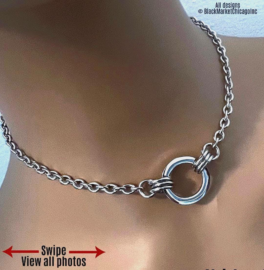 Submissive day collar; 24/7, waterproof, minimalist discreet; all stainless steel; oval cable chain; shiny 20mm round and flat center ring affixed by 3  jump rings on each side, optional permanent locking ring closure.