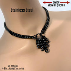 All black chunky stainless steel curb chain statement necklace; small center O-ring with a cluster of sparkling cascading graduated matching chains; goth, punk, rocker, grunge aesthetic.